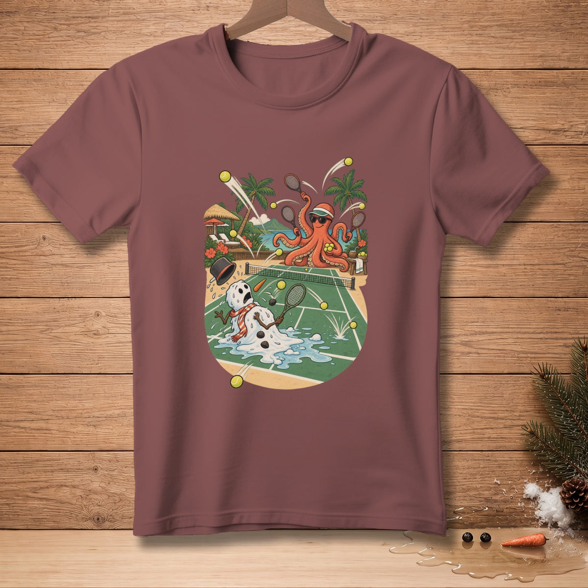 T-shirt graphic of an octopus playing tennis with a melting snowman on a beach court.