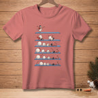 T-shirt with a comical progression of snowmen failing to assemble on blue shelves.