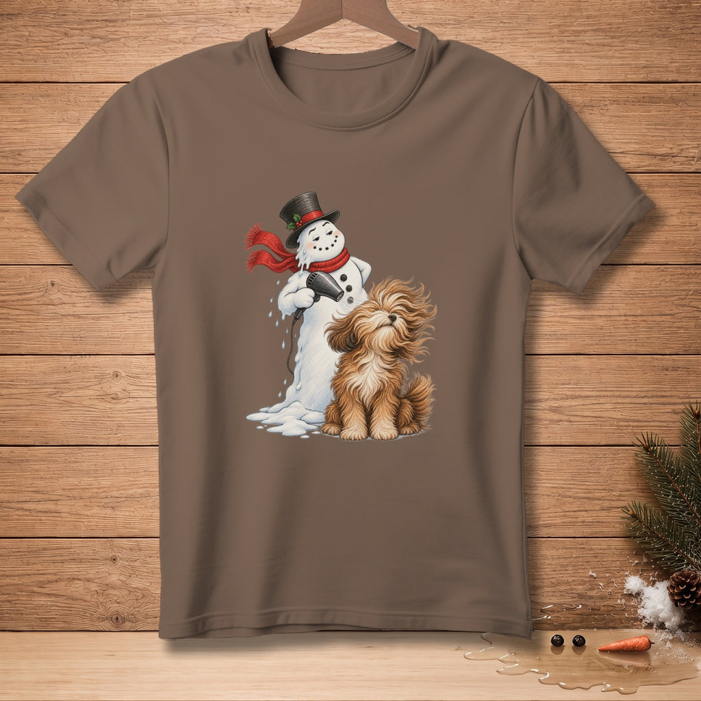 Snowman drying a fluffy dog with a hairdryer on a brown t-shirt.