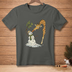 Giraffe eating a melting snowman's carrot nose and hat.