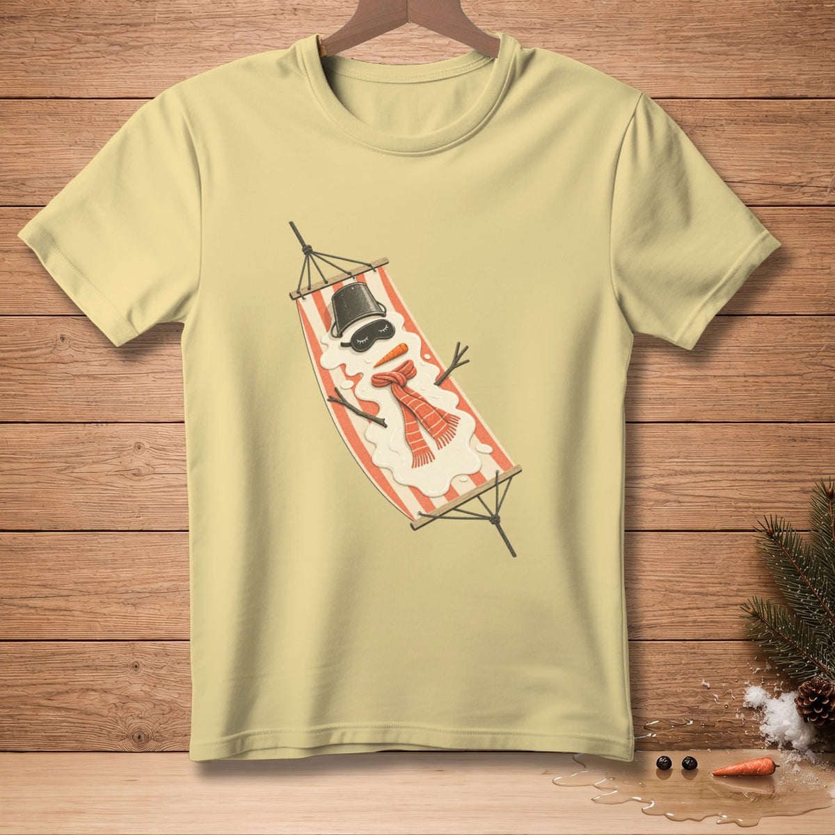 Light yellow t-shirt with a melting snowman on a hammock graphic.