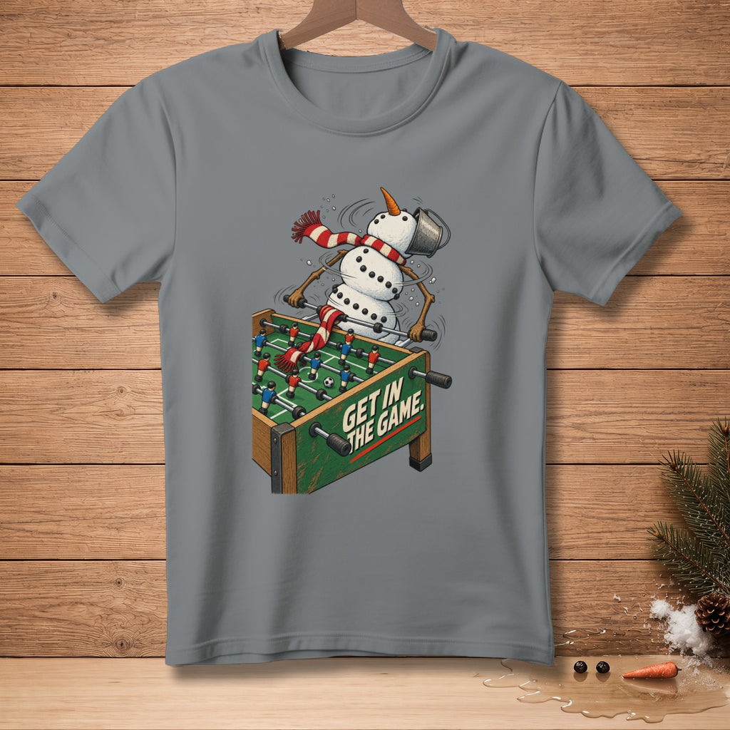 Snowman playing foosball with text "Get In The Game" on a grey t-shirt.