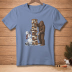 Bigfoot plays Jenga with a melting snowman under a Christmas tree branch.