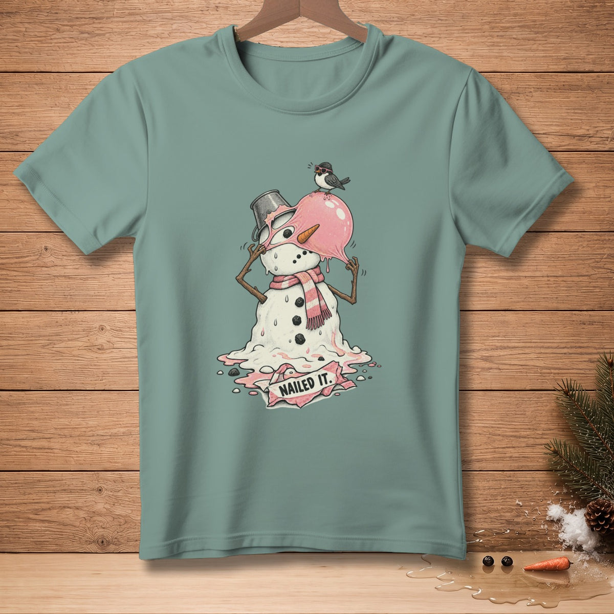 Melting snowman with a bird on its head and a banner saying "NAILED IT."