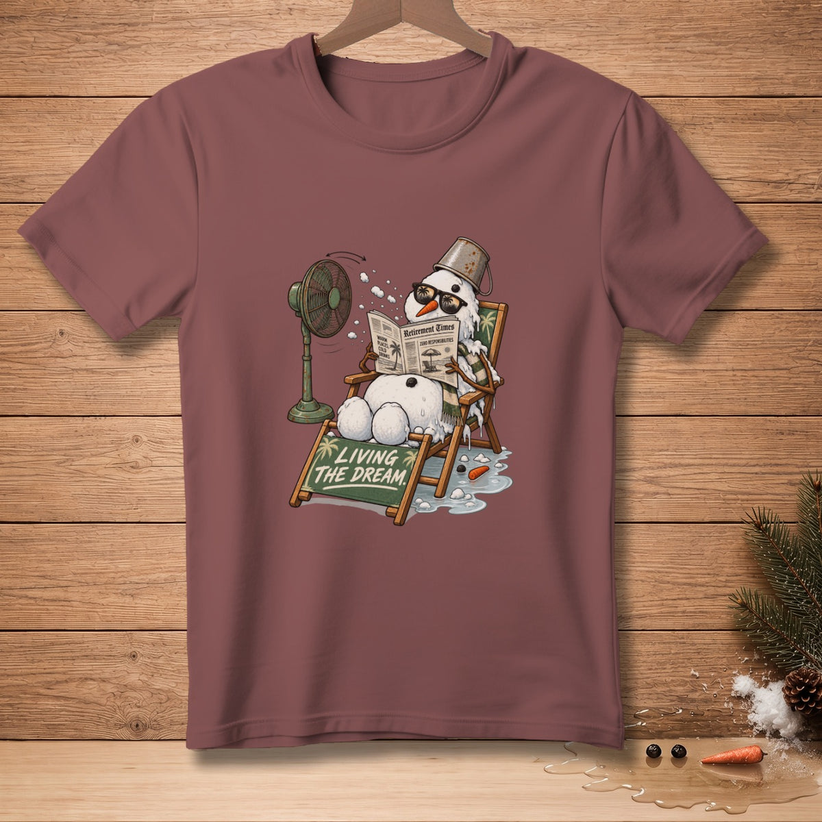 Snowman in lounge chair reading newspaper with fan and "LIVING THE DREAM" sign.