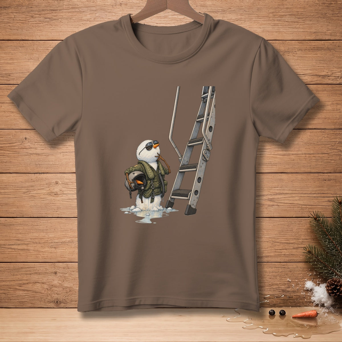 Snowman in pilot gear with helmet and ladder, melting on a brown t-shirt.