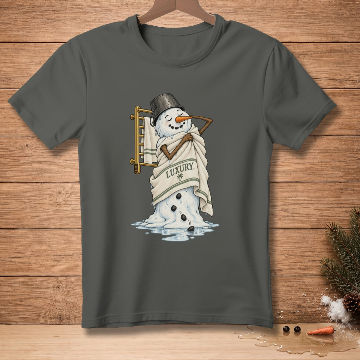 Melting snowman wrapped in a towel that says "LUXURY".