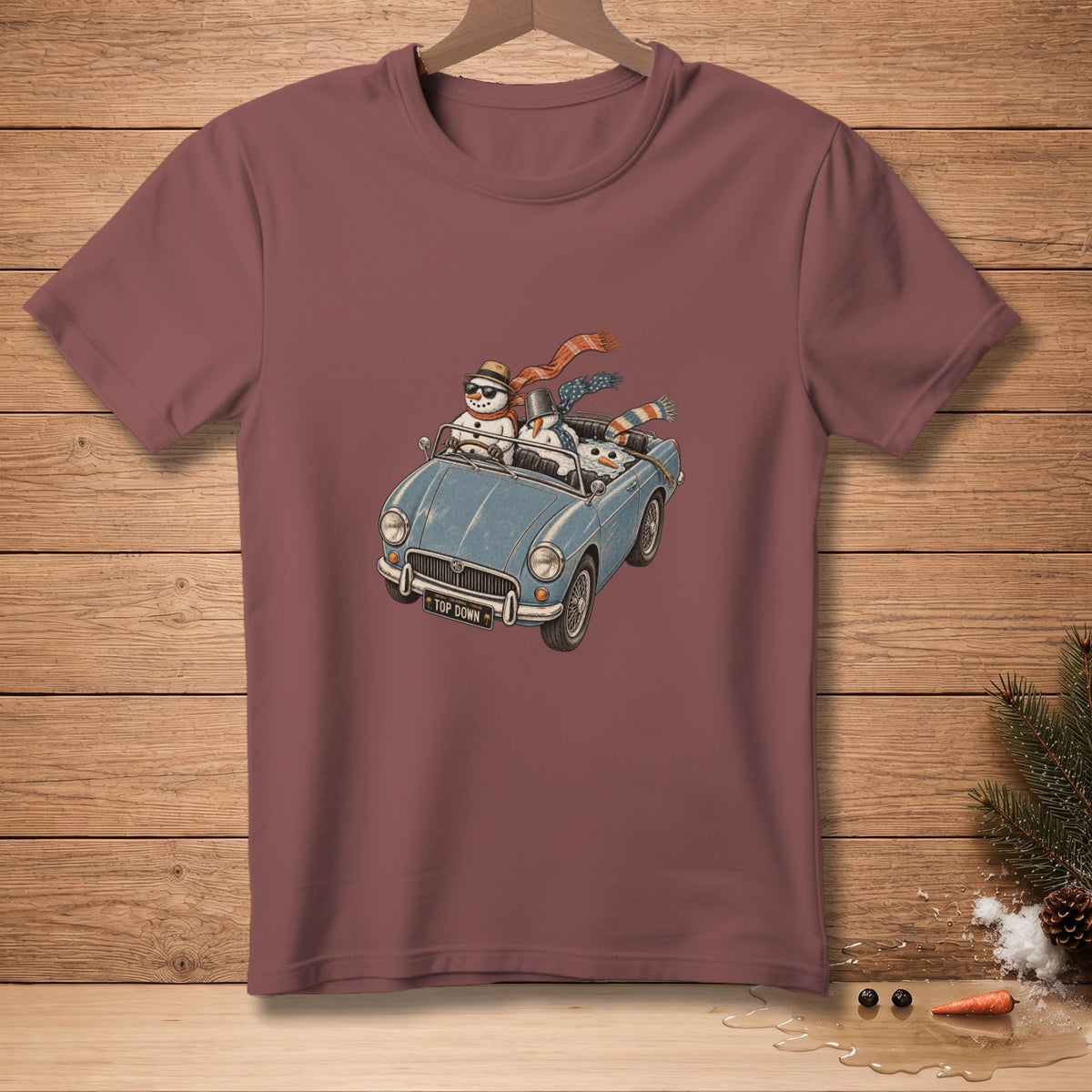 Snowmen in a convertible with scarves and hats, license plate reads "TOP DOWN".