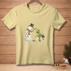 Alien interacting with a melting snowman and UFO on a light yellow t-shirt.