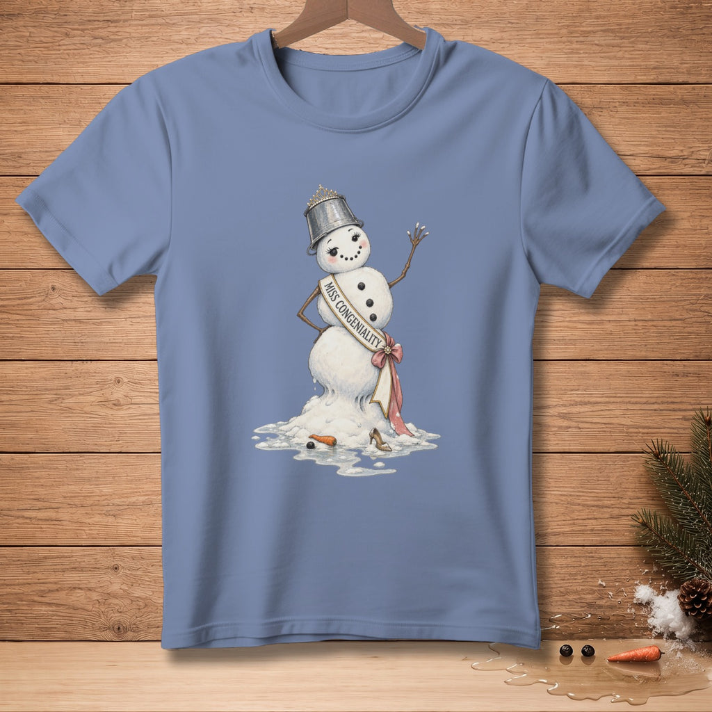 Melting snowman with tiara and sash labeled "Miss Congeniality" on blue t-shirt.