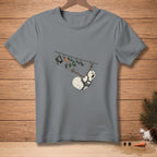 Scared snowman on a zipline with a hat, carrot, and scarf above.