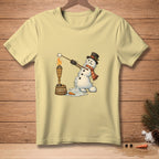 Melting snowman with marshmallow over a torch with "PATIENCE" on bucket.
