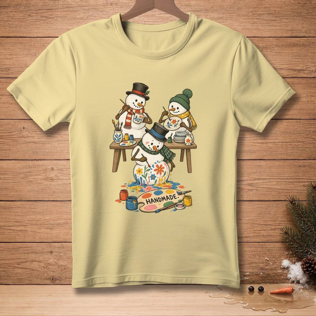Three snowmen painting, one melting, with "Handmade" text on a palette.