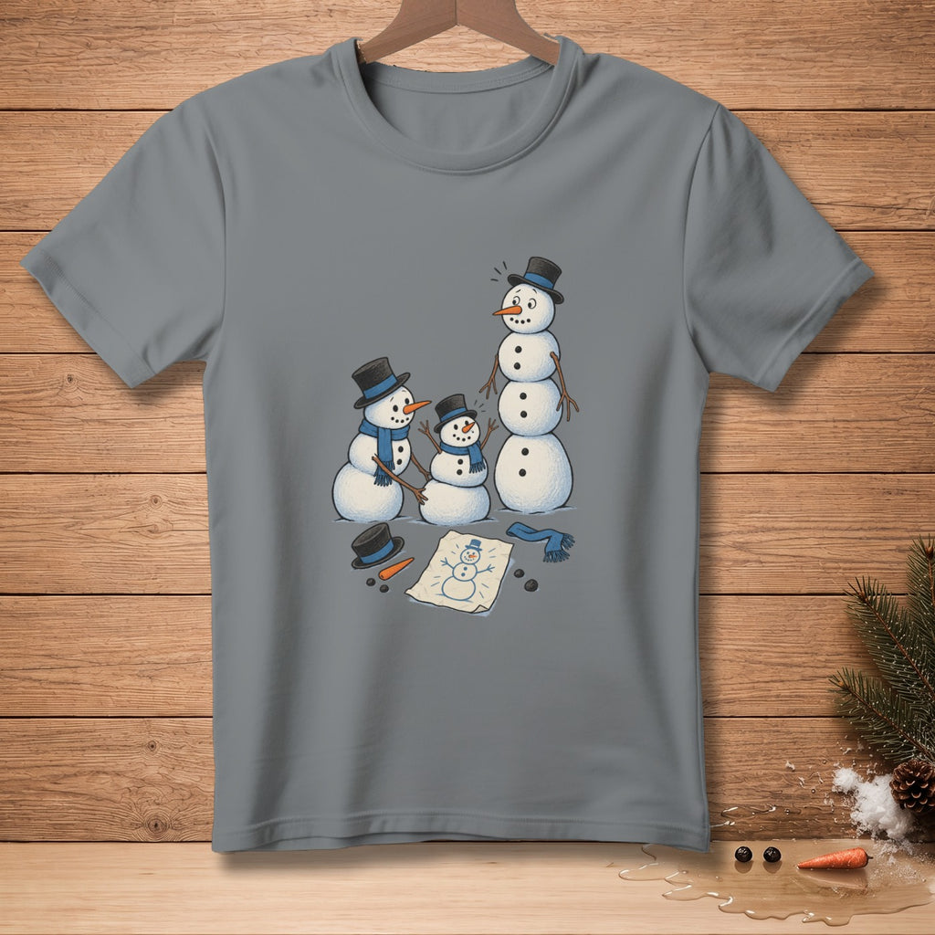 Grey t-shirt with three snowmen and a snowman drawing on paper.