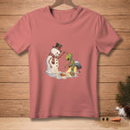 Alien interacting with melting snowman and UFO on pink t-shirt.