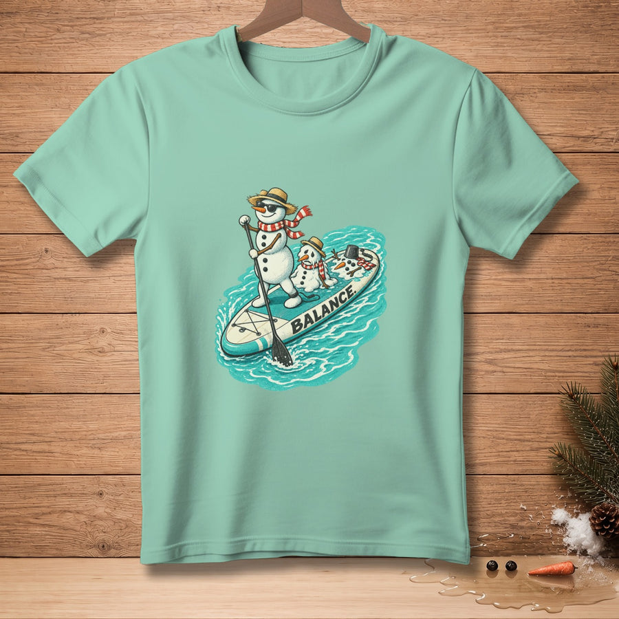 Two snowmen on a paddleboard with "BALANCE" text, on turquoise shirt.
