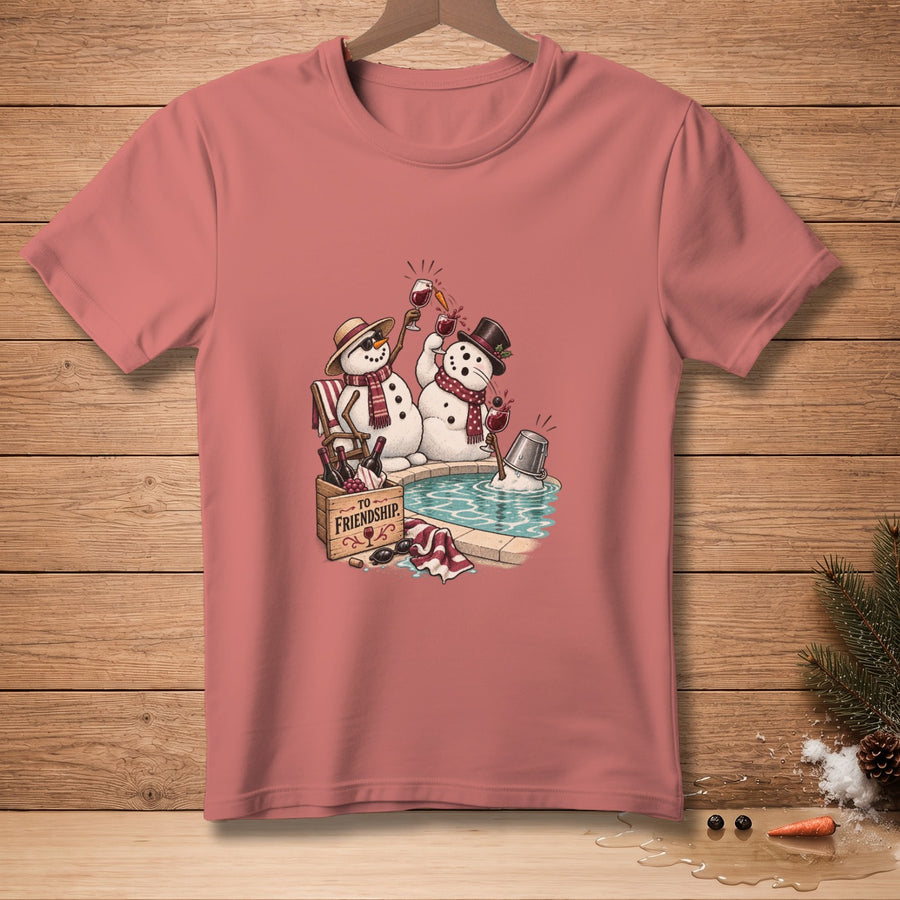 Two snowmen toasting drinks by a pool, with "TO FRIENDSHIP" text.
