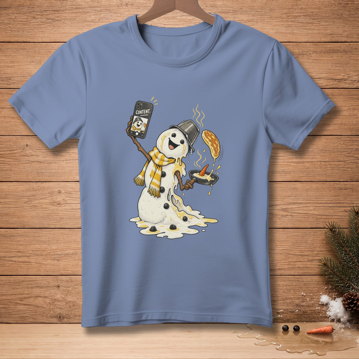 Melting snowman taking a selfie with a pancake in a pan.