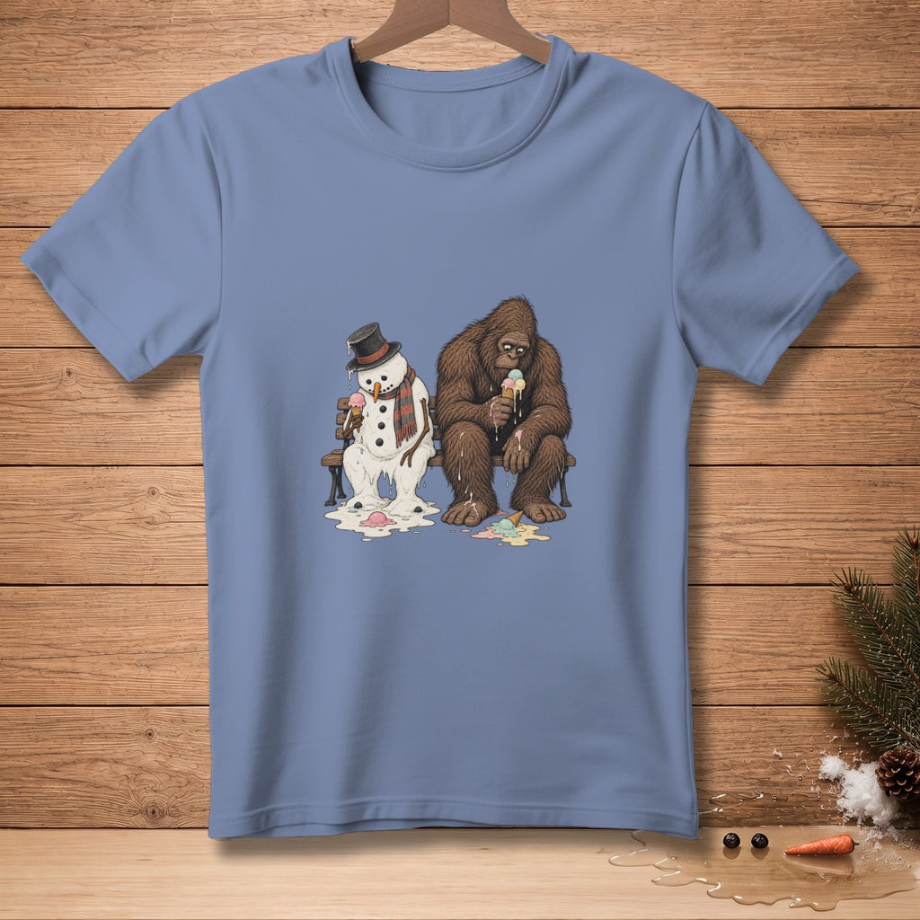 Melting snowman and Bigfoot sitting on a bench eating ice cream.