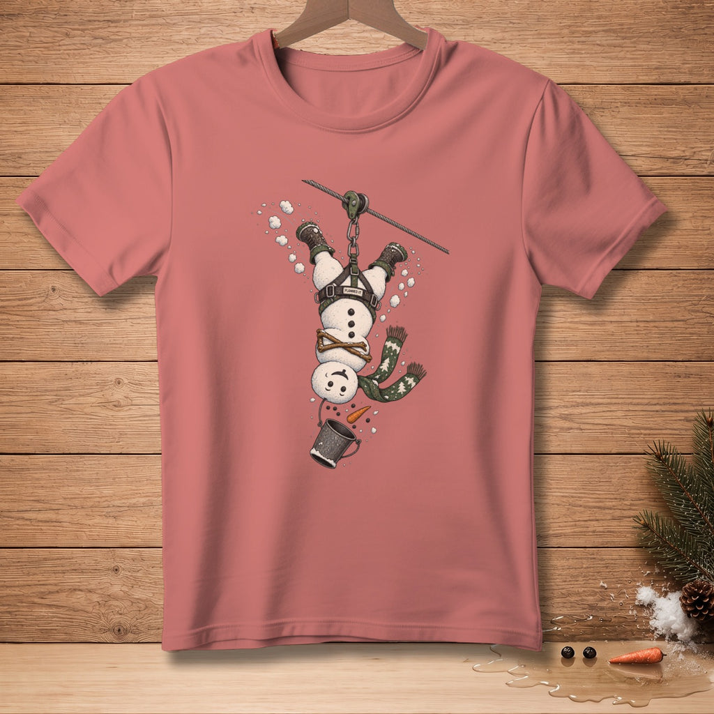 Pink t-shirt with a graphic of a snowman ziplining upside down.
