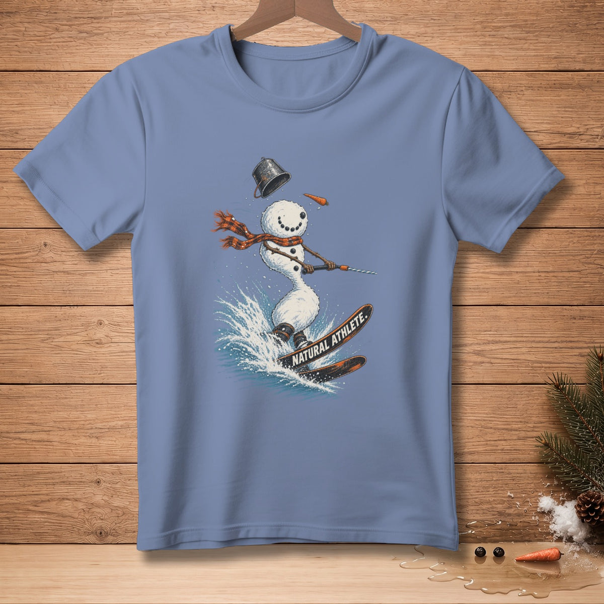 Snowman skiing through water splash with "NATURAL ATHLETE" text on skis.