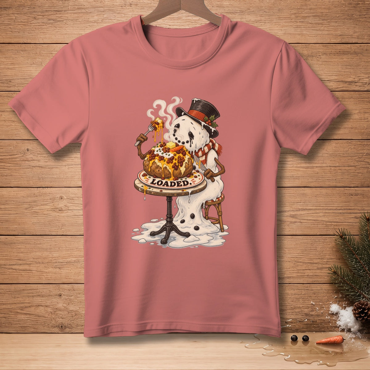 Snowman in a hat and scarf eating a loaded baked potato with the word "LOADED."