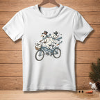 White t-shirt with snowmen on a tandem bike, text reads "WE FIT."