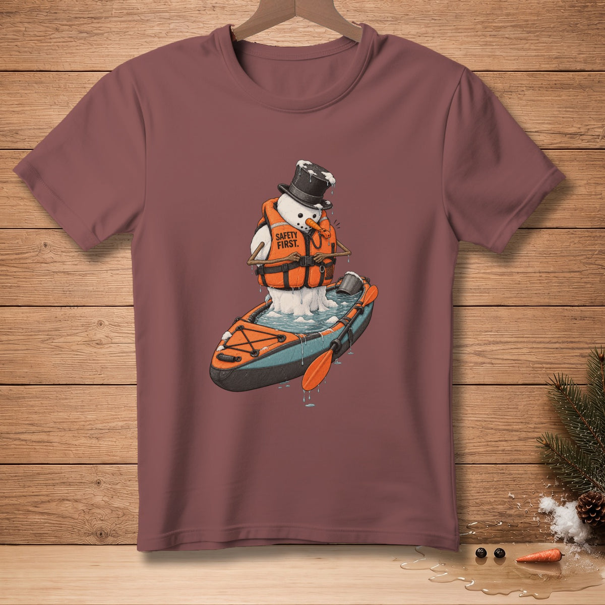 Snowman in life vest and top hat kayaking with text "SAFETY FIRST."