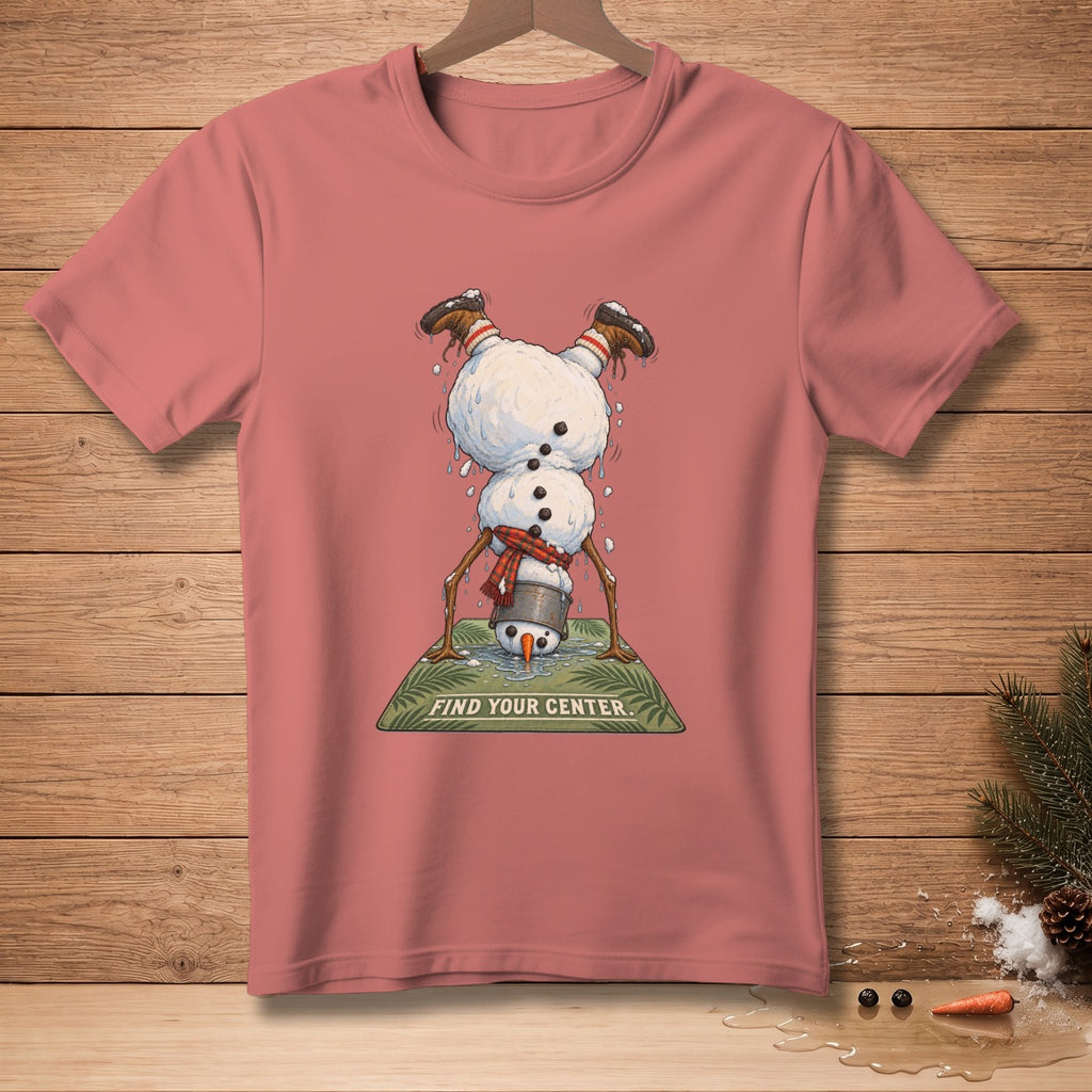 Pink t-shirt with upside-down snowman doing yoga and text "FIND YOUR CENTER".
