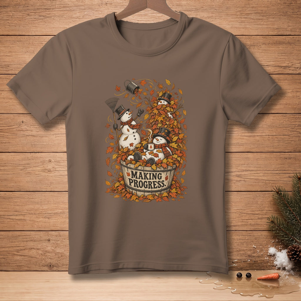 Three snowmen are in a bucket surrounded by autumn leaves with text "MAKING PROGRESS."