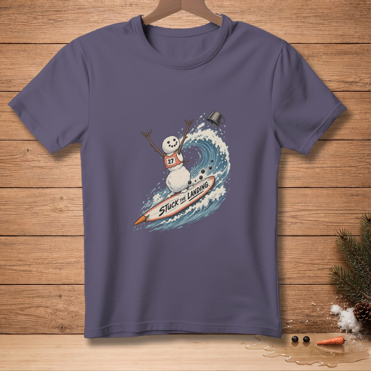 Snowman surfing a wave on a surfboard with text "Stuck The Landing".
