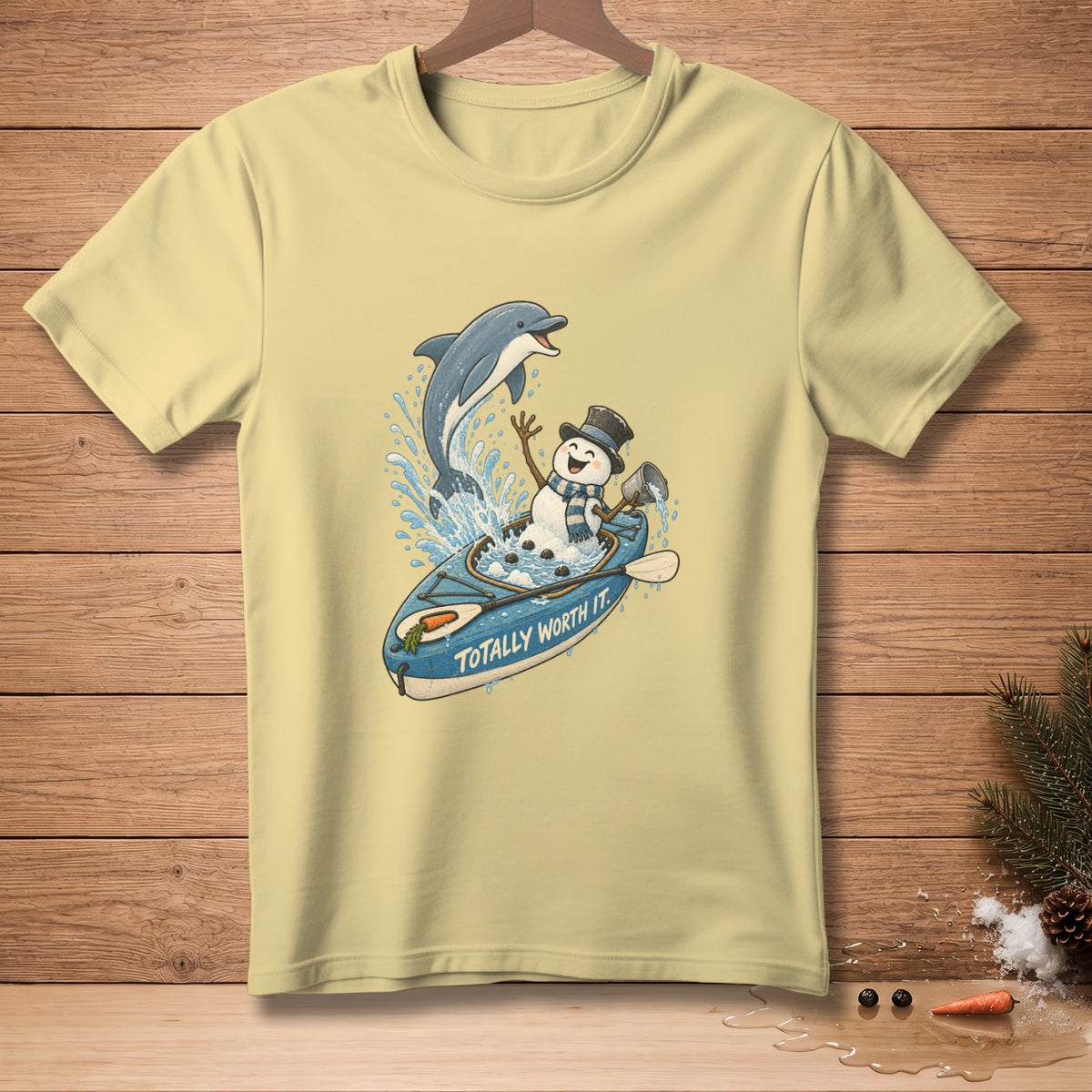 Snowman in a kayak with a dolphin, text "TOTALLY WORTH IT."