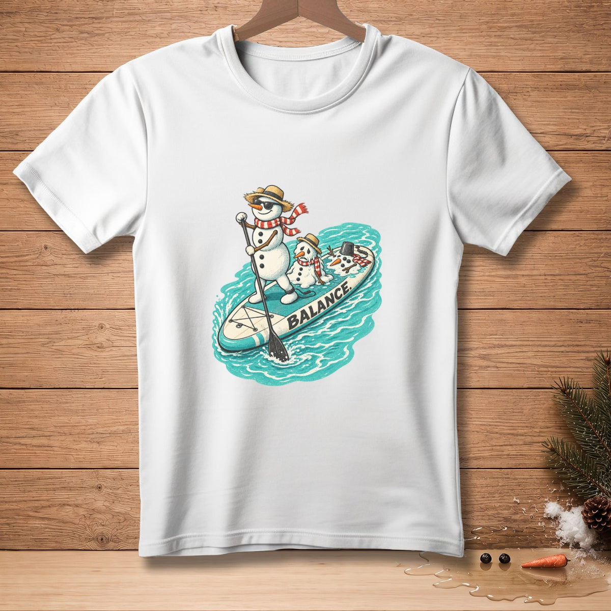 Snowmen on a paddleboard with text "BALANCE" printed on the board.
