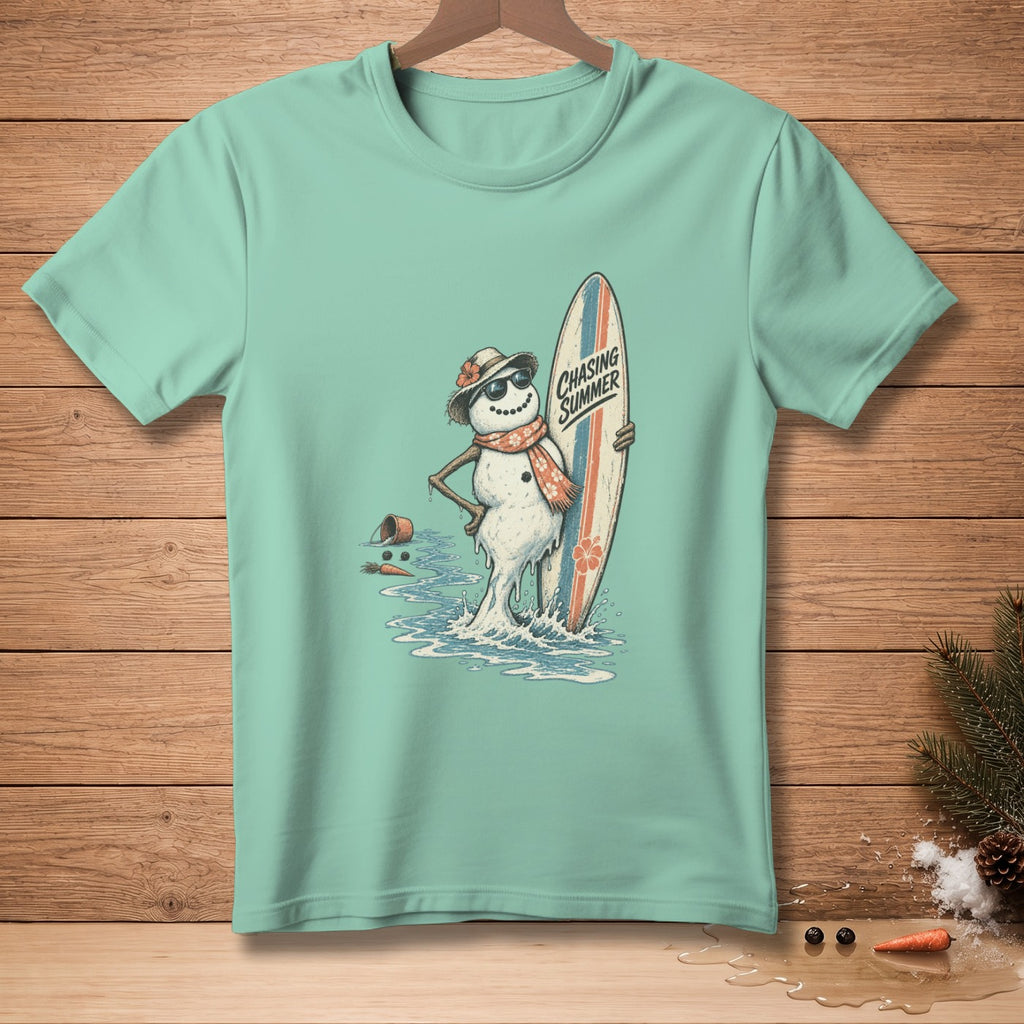 Snowman in sunglasses and scarf holding surfboard with "Chasing Summer" text.