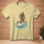 Bigfoot surfs on a melting snowman on a paddleboard.