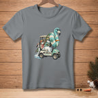 T-shirt with cartoon snowmen driving a golf cart with a flamingo float, text reads "WE CAN FIT IT."