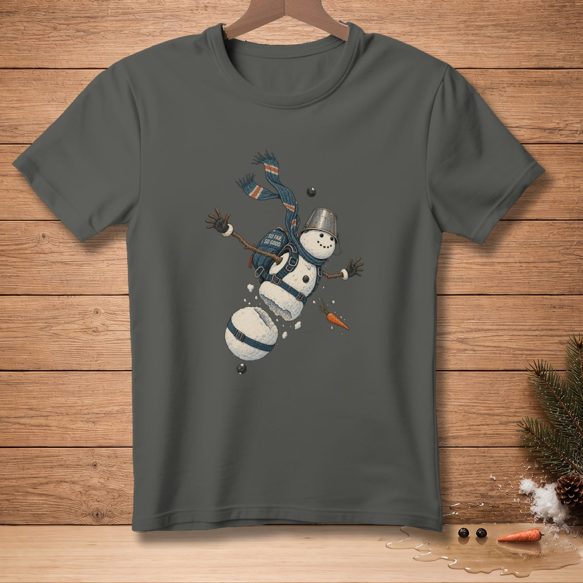 Dark grey t-shirt featuring a segmented snowman with a bucket hat, scarf, and "SO FAR SO GOOD" text.