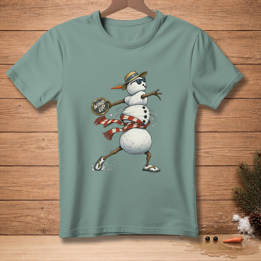 T-shirt with a cartoon snowman wearing a hat and sunglasses, holding a sign that says "Wind Up."