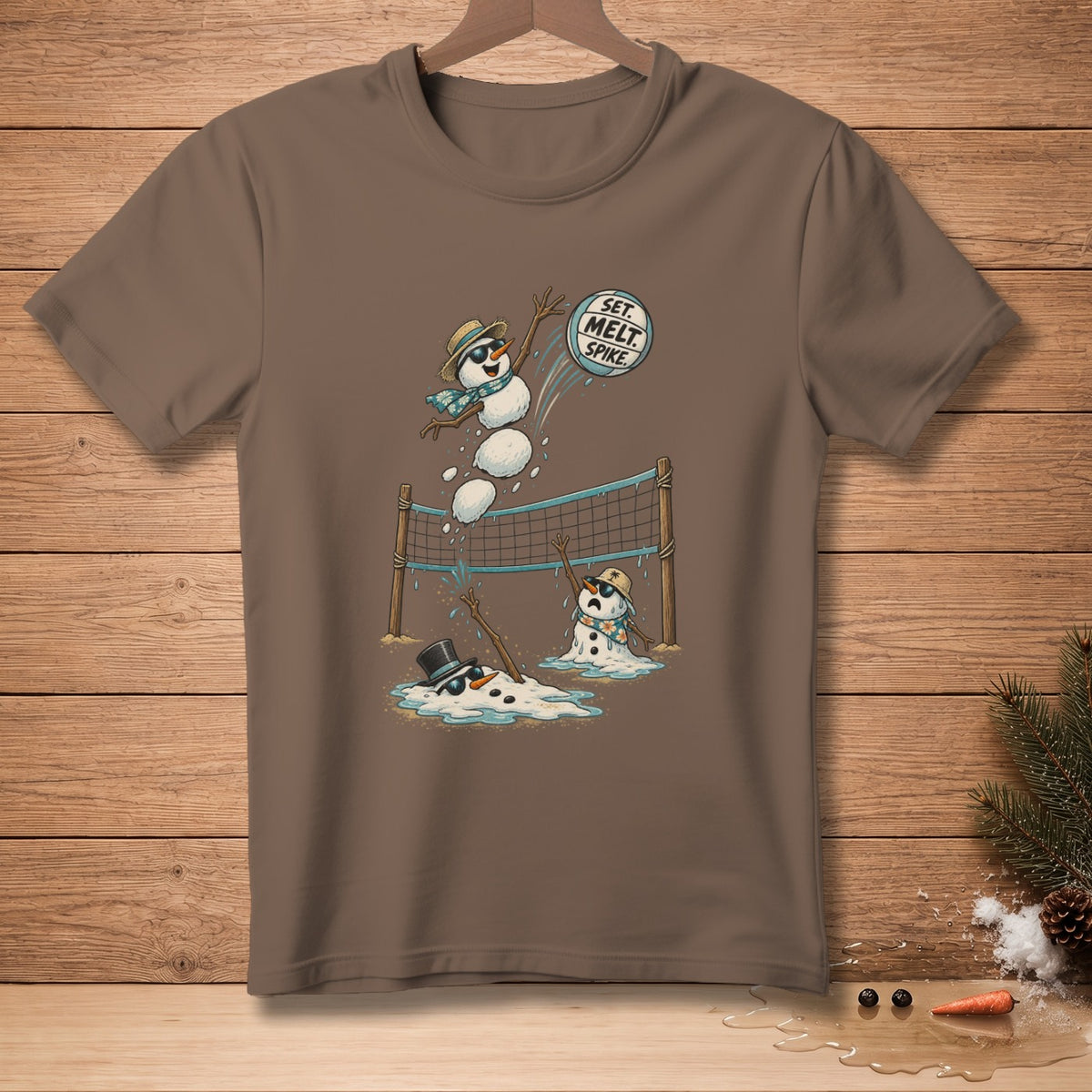 T-shirt with cartoon snowmen playing volleyball, one spiking a ball labeled "Set. Melt. Spike."
