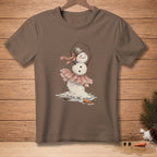 Brown t-shirt with illustration of a melting ballerina snowman wearing a pink tutu.