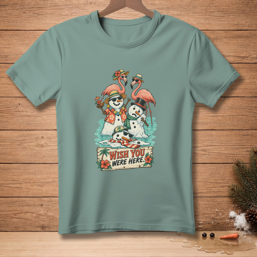 Snowmen and flamingos in water with "Wish You Were Here" sign.