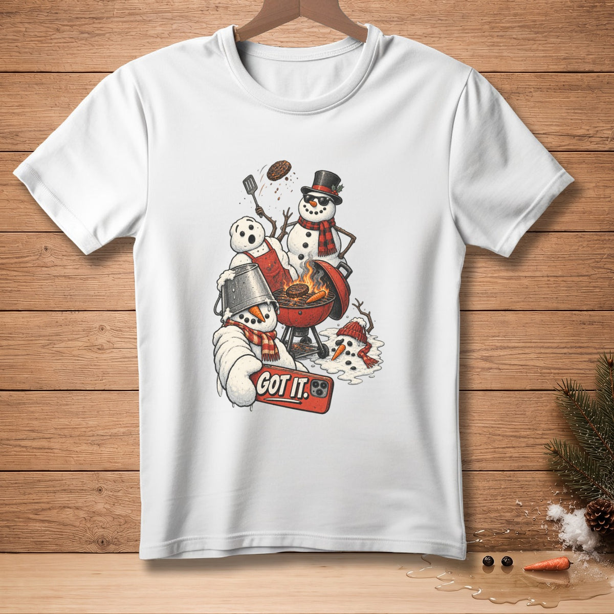 Snowmen grilling with a spatula flipping a burger and one holding a phone that says "GOT IT."