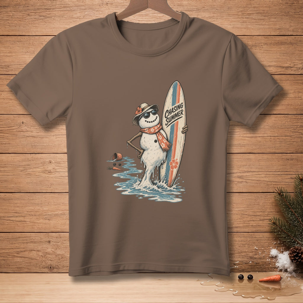 Brown t-shirt with a melting snowman holding a surfboard, text reads "Chasing Summer".