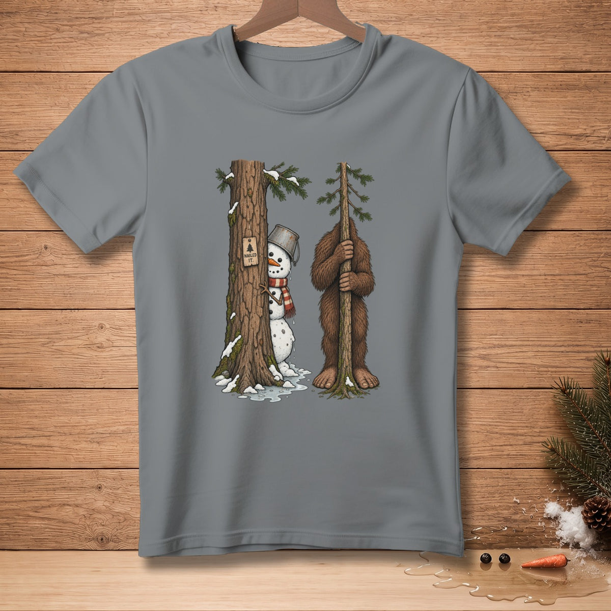 Snowman with bucket hat peeking from behind a tree next to Bigfoot holding a sapling.