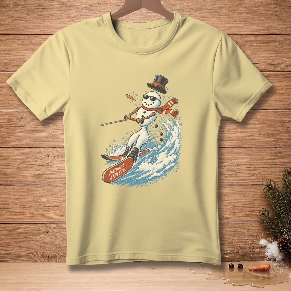 Snowman wearing sunglasses and hat water skiing on a wave, text "NATURAL ATHLETE"