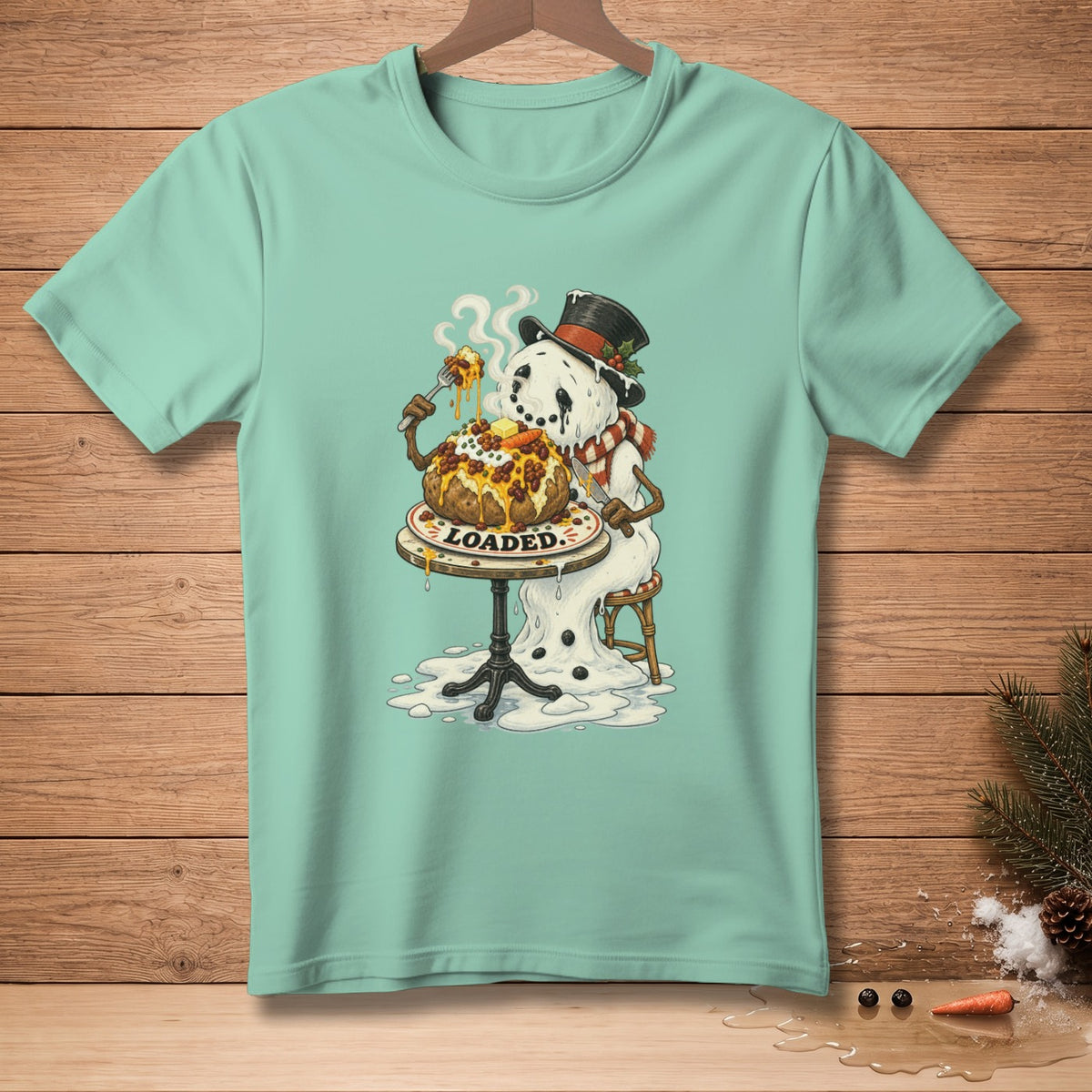 Snowman in a hat and scarf eating a loaded baked potato, text "LOADED."