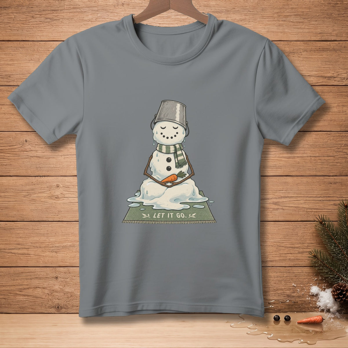 Melting snowman with a bucket on its head sits on a mat that reads "LET IT GO."