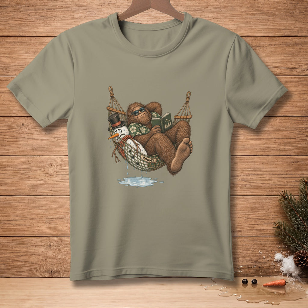 Bigfoot reading in a hammock with a snowman, text "ROOMY" on hammock.