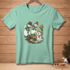 Snowmen gardening with flowers and watering can on a light teal t-shirt.