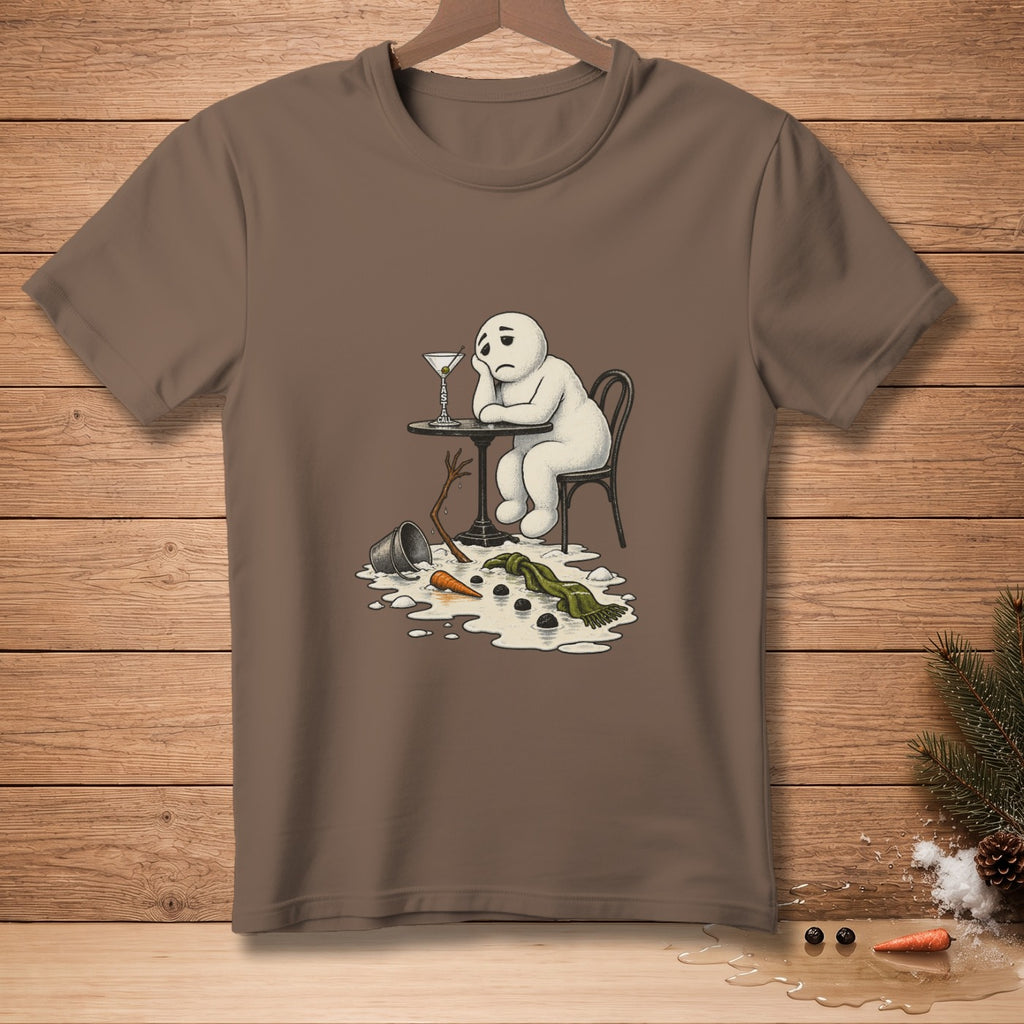 Brown t-shirt with a melting snowman sitting at a table with a drink.
